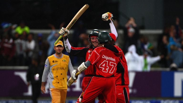 CAPE TOWN, SOUTH AFRICA - SEPTEMBER 12:  Brendon Taylor of Zimbabwe is mobbed by teammates after scoring the winning runs during the ICC Twenty20 World Cha