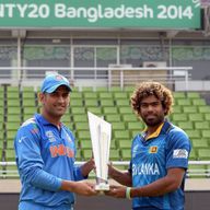 Mahendra Singh Dhoni and Lasith Malinga pose with the World T20 trophy