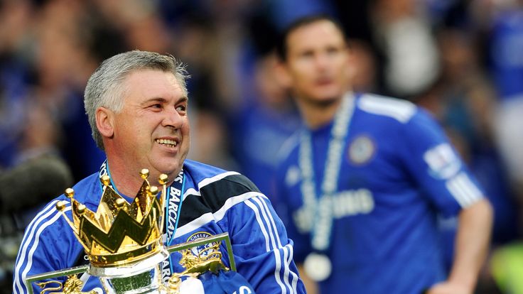 Chelsea manager Carlo Ancelotti celebrates with the Barclays Premier League trophy after Chelsea win the title in 2010.