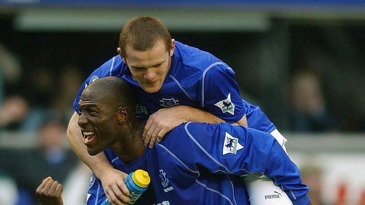 LIVERPOOL - 19 OCTOBER:  Wayne Rooney of Everton celebrates with Kevin Campbell after scoring winning goal in Premiership match v Arsenal at Goodison Park