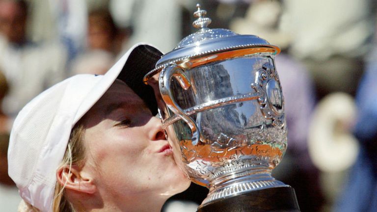- Belgiums Justine Henin-Hardenne kisses her trophy following her Roland Garros French Tennis Open women singles final match against her compatriot Kim Clijsters, 07 June 2003 in Paris