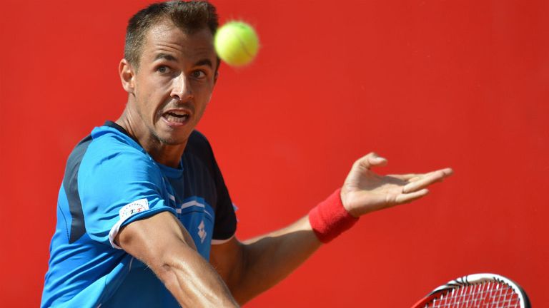- Czech Republics Lukas Rosol returns the ball to Spains Guillermo Garcia-Lopez during the final of the ATP tennis tournament in Bucharest, Romania