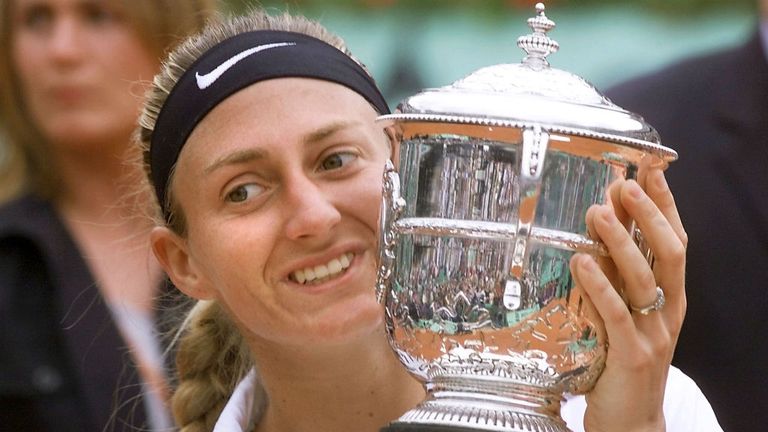 - French player Mary Pierce holds the Suzanne Lenglen winner trophy after defeating Spanish opponent Conchita Martinez in their womens singles final match, 10 June 2000