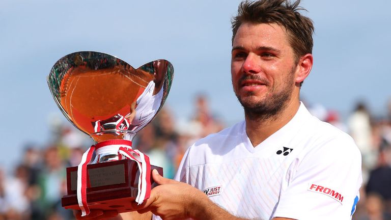 - Stanislas Wawrinka of Switzerland lifts the winners trophy against Roger Federer of Switzerland in the final during day eight of the ATP Monte Carlo Rolex Masters