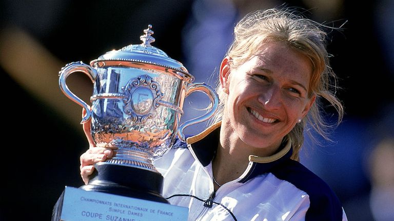 - Steffi Graf of Germany celebrates with the championship trophy after defeating Martina Hingis of Switzerland to win the womens singles final of the French Open Tennis at Roland Garros