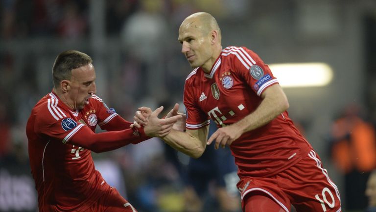 Bayern Munich's French midfielder Franck Ribery (L) celebrates with Bayern Munich's Dutch midfielder Arjen Robben after he scored a goal during the UEFA Ch