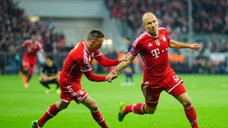 Arjen Robben celebrates after scoring Bayern Munich's third against Manchester United