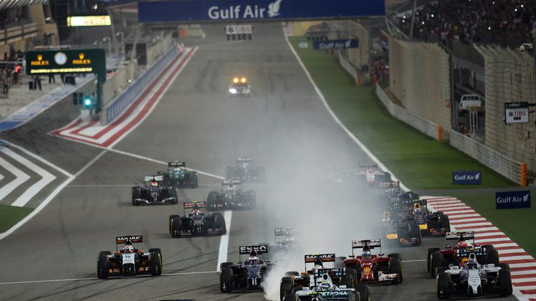 Lewis Hamilton passes Nico Rosberg at the start of the race