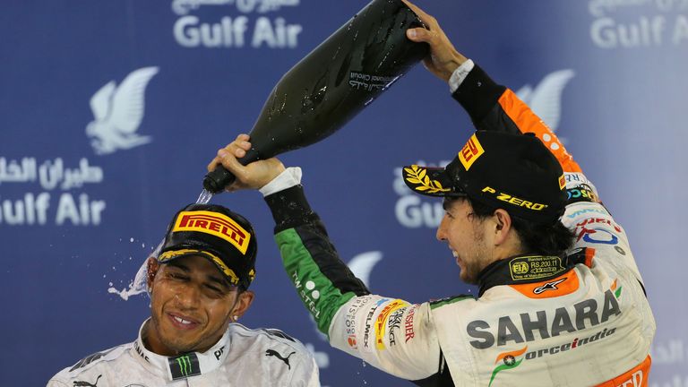 Lewis Hamilton and Sergio Perez celebrate on the podium