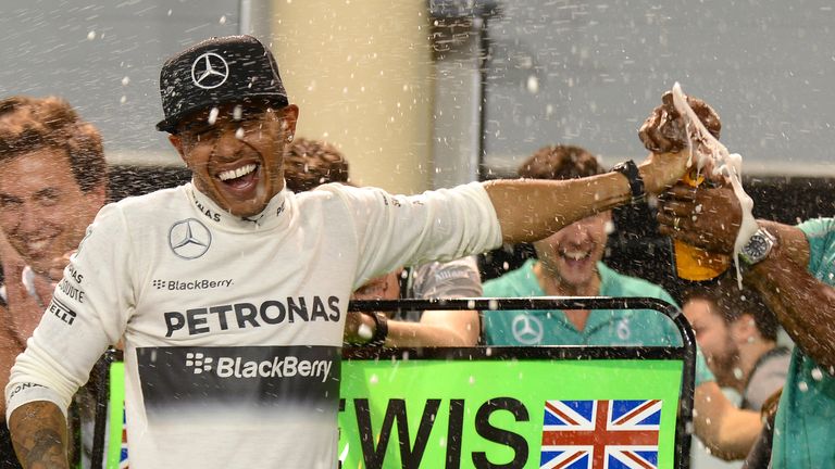 Race winner Lewis Hamilton celebrates