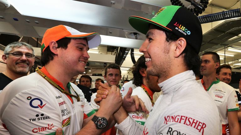 Sergio Perez celebrates his third place with the team
