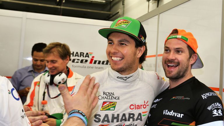 Sergio Perez celebrates his third place with the team