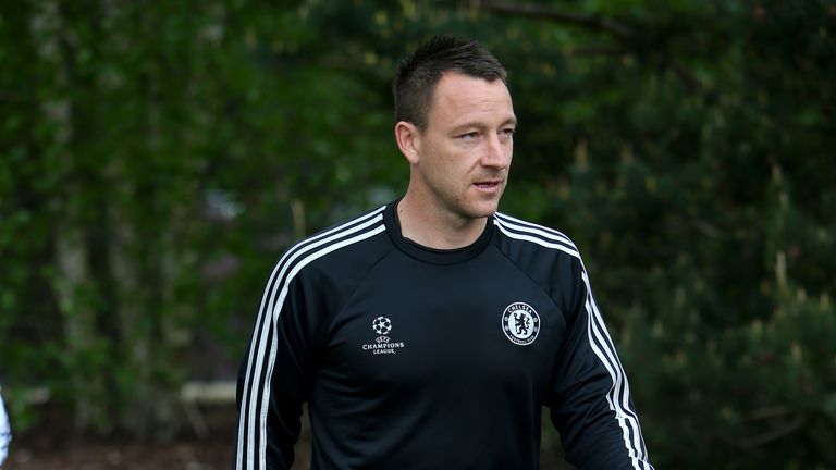 COBHAM, ENGLAND - APRIL 29:  John Terry of Chelsea walks out to the pitch prior to a training session at Chelsea Training Ground on April 29, 2014 in Cobha