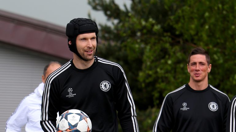 COBHAM, ENGLAND - APRIL 29:  Petr Cech of Chelsea walks out to the pitch prior to a training session at Chelsea Training Ground on April 29, 2014 in Cobham