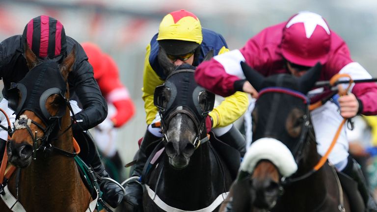 LIVERPOOL, ENGLAND - APRIL 03: Paul Carberry riding Guitar Pete (C) clear the last to win The IJF 50th Anniversary Juvenile Hurdle at Aintree racecourse on