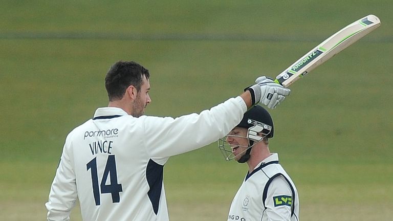 SOUTHAMPTON, ENGLAND - APRIL 11: James Vince of Hampshire celebrates with Adam Wheater after making a century during day two of the LV County Championship 
