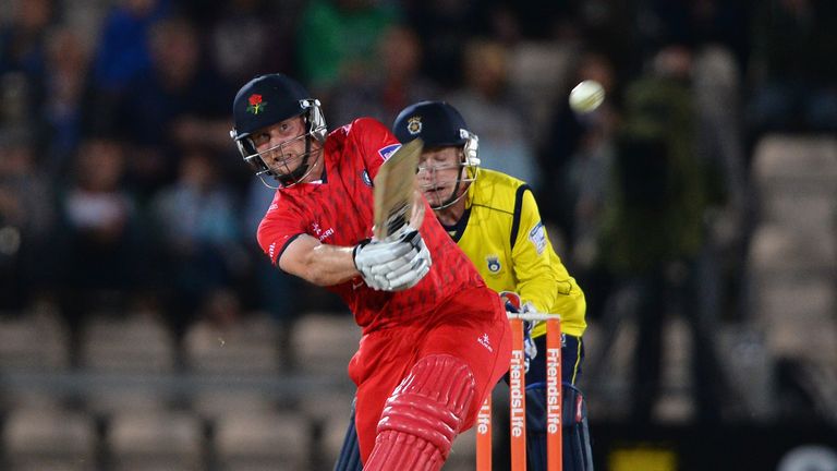 Karl Brown of Lancashire smashes the ball to the boundary for four