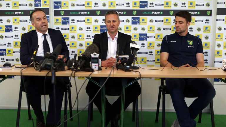 Norwich City chief executive David McNally and new manager Neil Adams (c) with team captain Russell Martin (r) during press conference