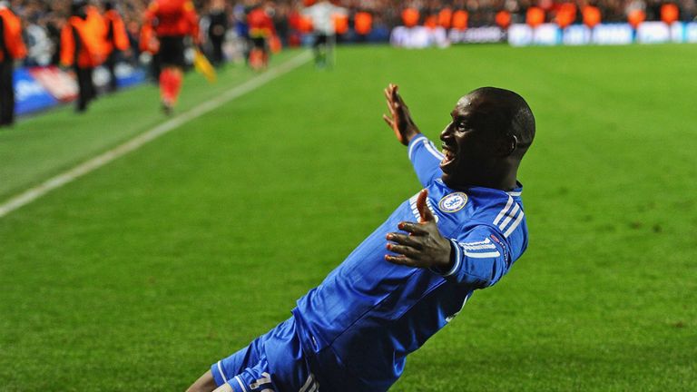 Demba Ba slides towards the Chelsea fans after sending them into the Champions League semi-finals