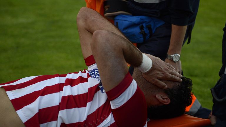 Atletico Madrid's Brazilian-born forward Diego da Silva Costa is stretchered off after injuring his left leg during the Spanish league football match 