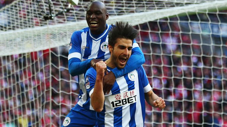 LONDON, ENGLAND - APRIL 12:  Jordi Gomez of Wigan Athletic celebrates scoring from the penalty spot with Marc-Antoine Fortune of Wigan Athletic during the 