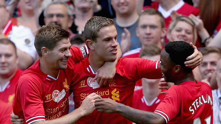 Jordan Henderson of Liverpool is congratulated by Steven Gerrard and Raheem Sterling