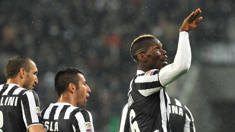 Paul Pogba (R) of Juventus celebrates after scoring the opening goal during the Serie A match between Juventus and Bologna FC at 