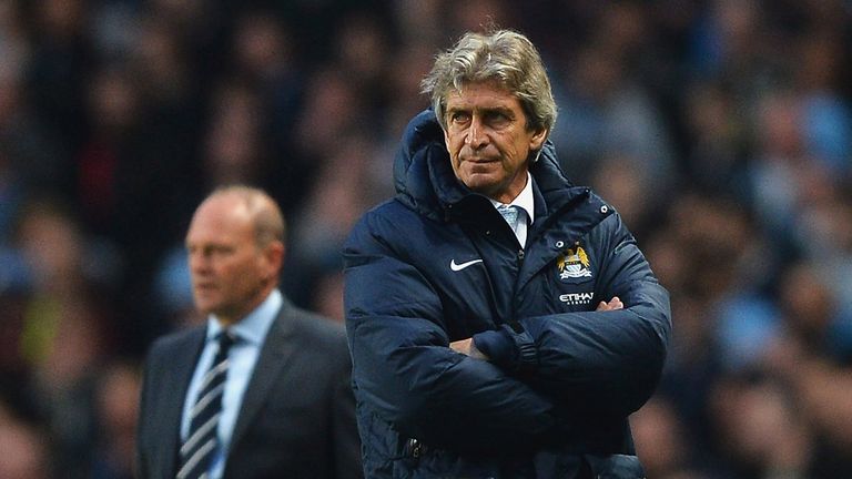 MANCHESTER, ENGLAND - APRIL 21:  Manuel Pellegrini manager of Manchester City (R) and Pepe Mel manager of West Bromwich Albion (L) look on from the touchli