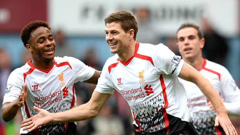 LONDON, ENGLAND - APRIL 06:  Steven Gerrard (C)of Liverpool celebrates with teammate Raheem Sterling (L) after scoring the opening goal from the penalty sp