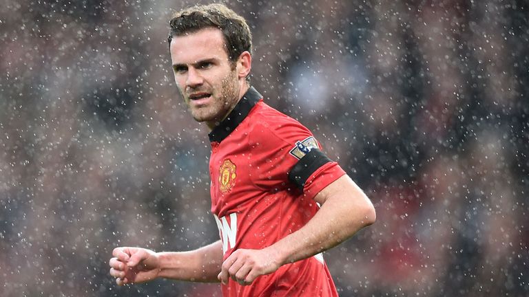 MANCHESTER, ENGLAND - APRIL 26: Juan Mata of Manchester United in a rain during the Barclays Premier League match between Manchester United and Norwich Cit