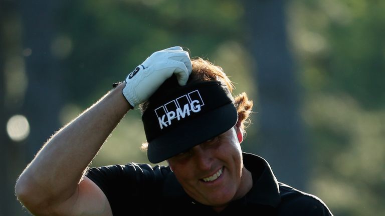 Phil Mickelson of the United States on the 17th hole during the first round of the 2014 Masters Tournament at Augusta National