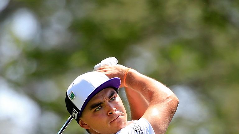 Rickie Fowler of the United States hits a shot on the fourth hole during the third round of the 2014 Masters Tournament at Augusta