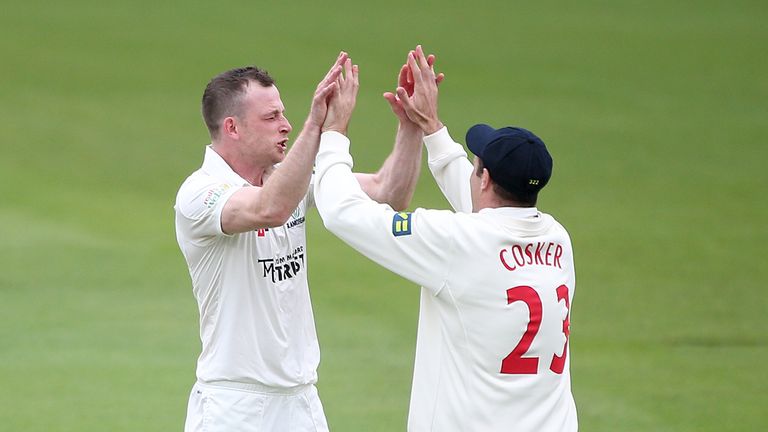 LONDON, ENGLAND - APRIL 06: Graham Wagg of Glamorgan (L) celebrates taking the wicket of Surrey's Graeme Smith during day one of the LV County Championship