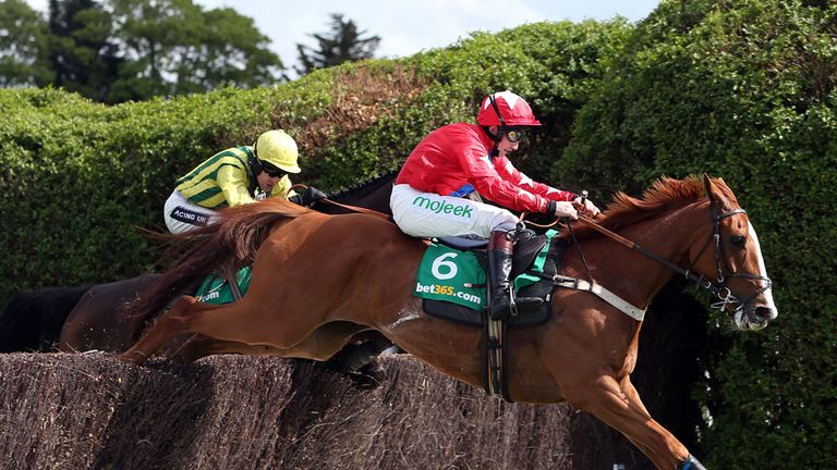 Sire De Grugy (right) ridden by Jamie Moore beats Pepite Rose (yellow colours) ridden by Aidan Coleman to bet365 Clelebration Steeple Chase  during the Bet