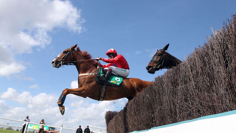 Sire De Grugy (left) ridden by Jamie Moore beats Pepite Rose (yellow colours) ridden by Aidan Coleman to bet365 Clelebration Steeple Chase  during the Bet3
