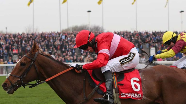 Silviniaco Conti ridden by Noel Fehily jumps the last fence ahead of Dynaste ridden by Tom Scudamore