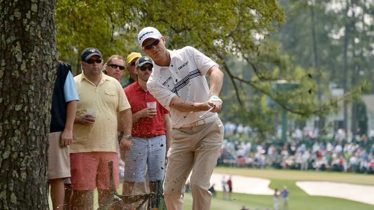 John Senden of Australia plays out of the wood on the first hole during the second round of the 78th Masters Golf Tournament at Augusta National Golf Club 