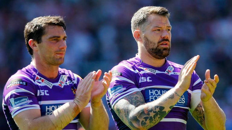 ST HELENS, ENGLAND - APRIL 18:  Matty Smith (L) and Jordan James of Wigan thank the travelling fans after the Super League match between St Helens and Wiga