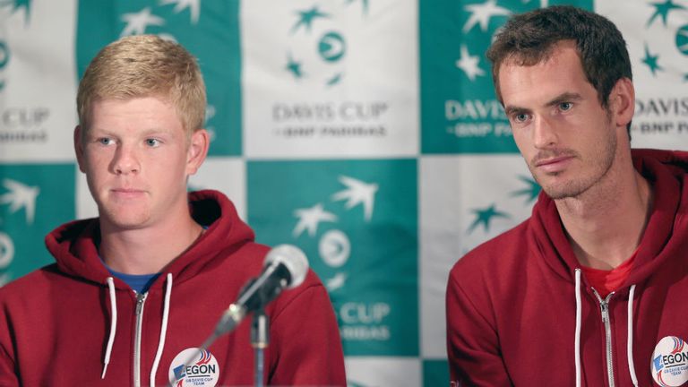 Andy Murray of Great Britain answers questions from the media as team mate Kyle Edmund listens before his first round match against the United States