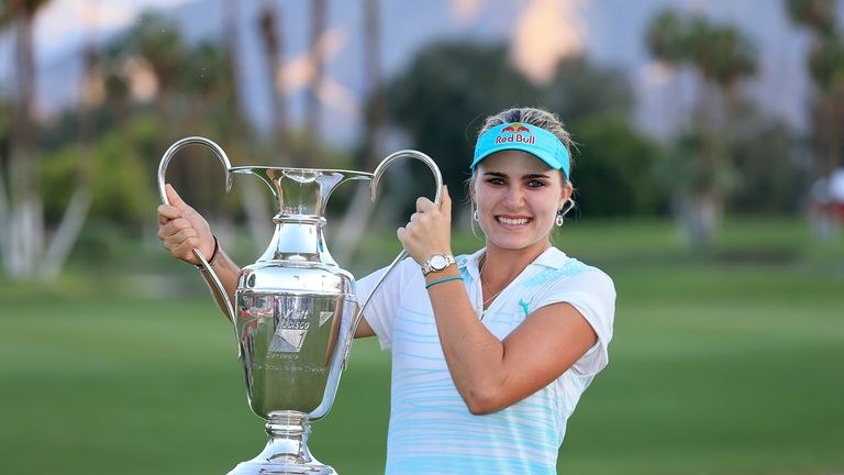 Lexi Thompson of the USA proudly holds the trophy after her three shot win during the final round of the 2014  Kraft Nabisco Championship