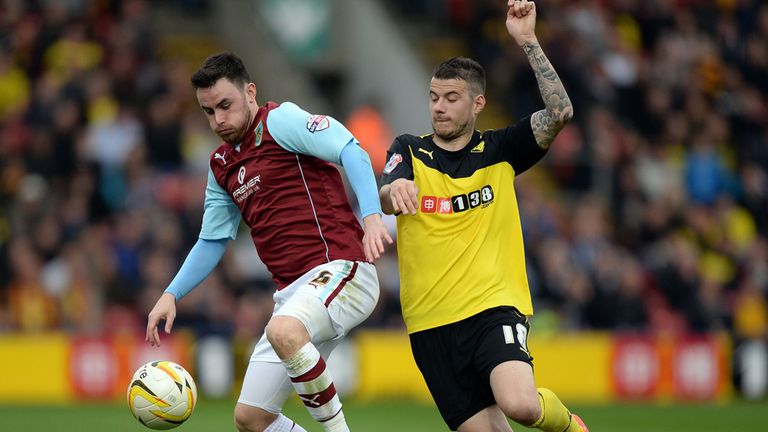 Burnley's Luke O'Neill (left) and Watford's Daniel Pudil battle for the ball during the Sky Bet Championship match at Vicarage Road, Watford.