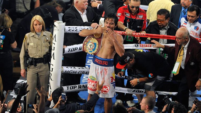 Manny Pacquiao celebrates after his victory over Timothy Bradley during their WBO world welterweight champion.