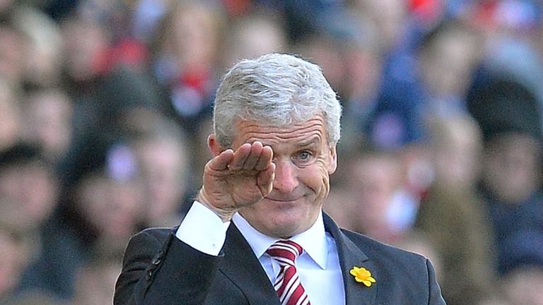 Stoke City manager Mark Hughes gestures from the touchline during the English Premier League football match between Stoke City and Arsenal