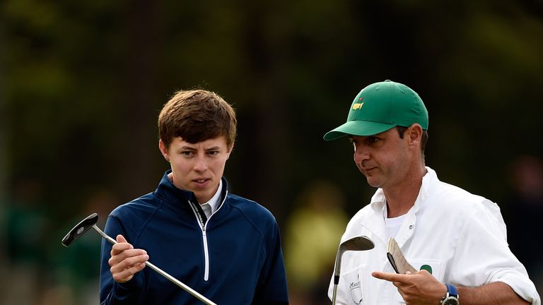 Amateur Matthew Fitzpatrick with his caddie during a practice round for the 2014 Masters