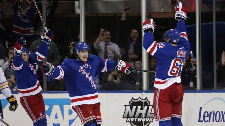 Rick Nash #61 of the New York Rangers (R) celebrates his game winning goal at 18:18 of the third period along with Raphael Diaz #4