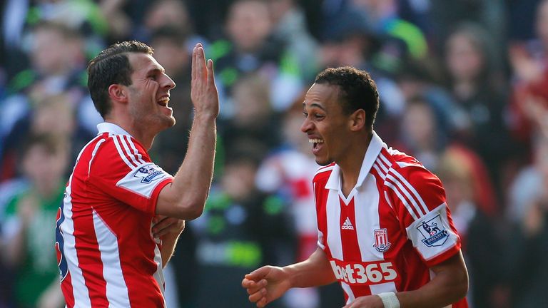 STOKE ON TRENT, ENGLAND - MARCH 29:  Peter Odemwingie (R) of Stoke City celebrates his goal with Erik Pieters of Stoke City during the Barclays Premier Lea
