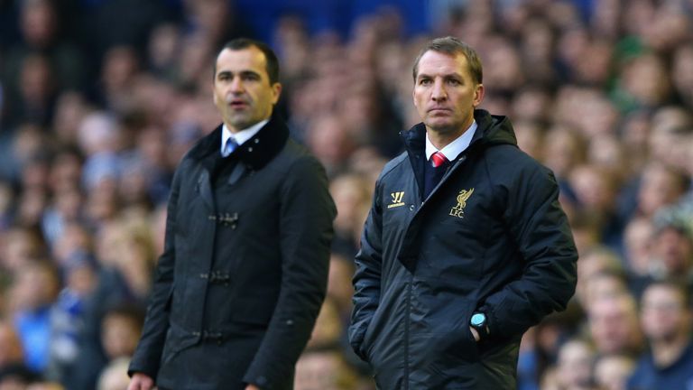 LIVERPOOL, ENGLAND - NOVEMBER 23:  Liverpool Manager Brendan Rodgers (R) and Everton Manager Roberto Martinez look on during the Barclays Premier League ma