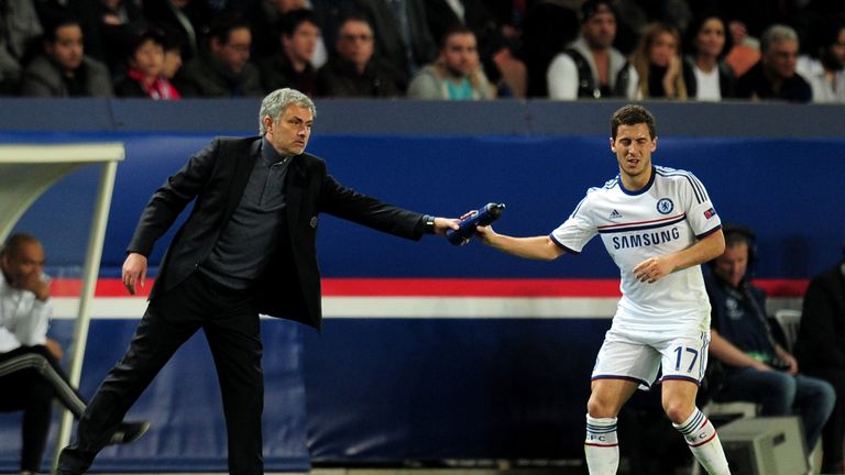 Jose Mourinho, the Chelsea manager, hands a water bottle to Eden Hazard of Champions League quarter-final first leg defeat at PSG. Apr 2 2014.