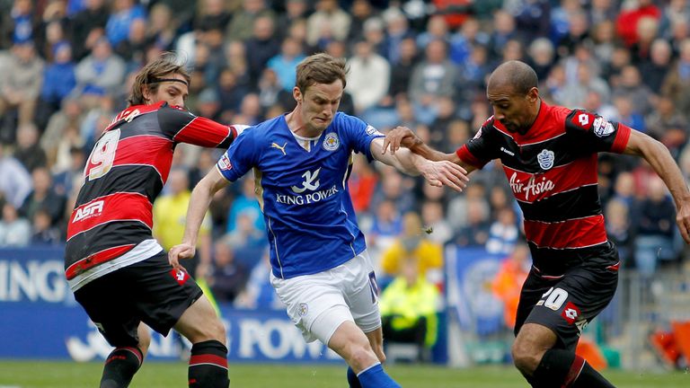 Leicester City's Andy King (centre) battles for the ball with Queens Park Rangers' Niko Kranjaer and Karl Henry