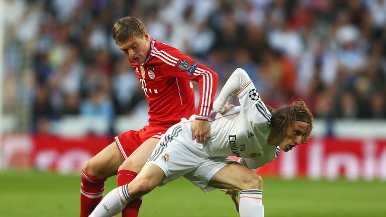 Toni Kroos of Bayern Munich challenges Luka Modric of Real Madrid during the UEFA Champions League semi-final first leg match
